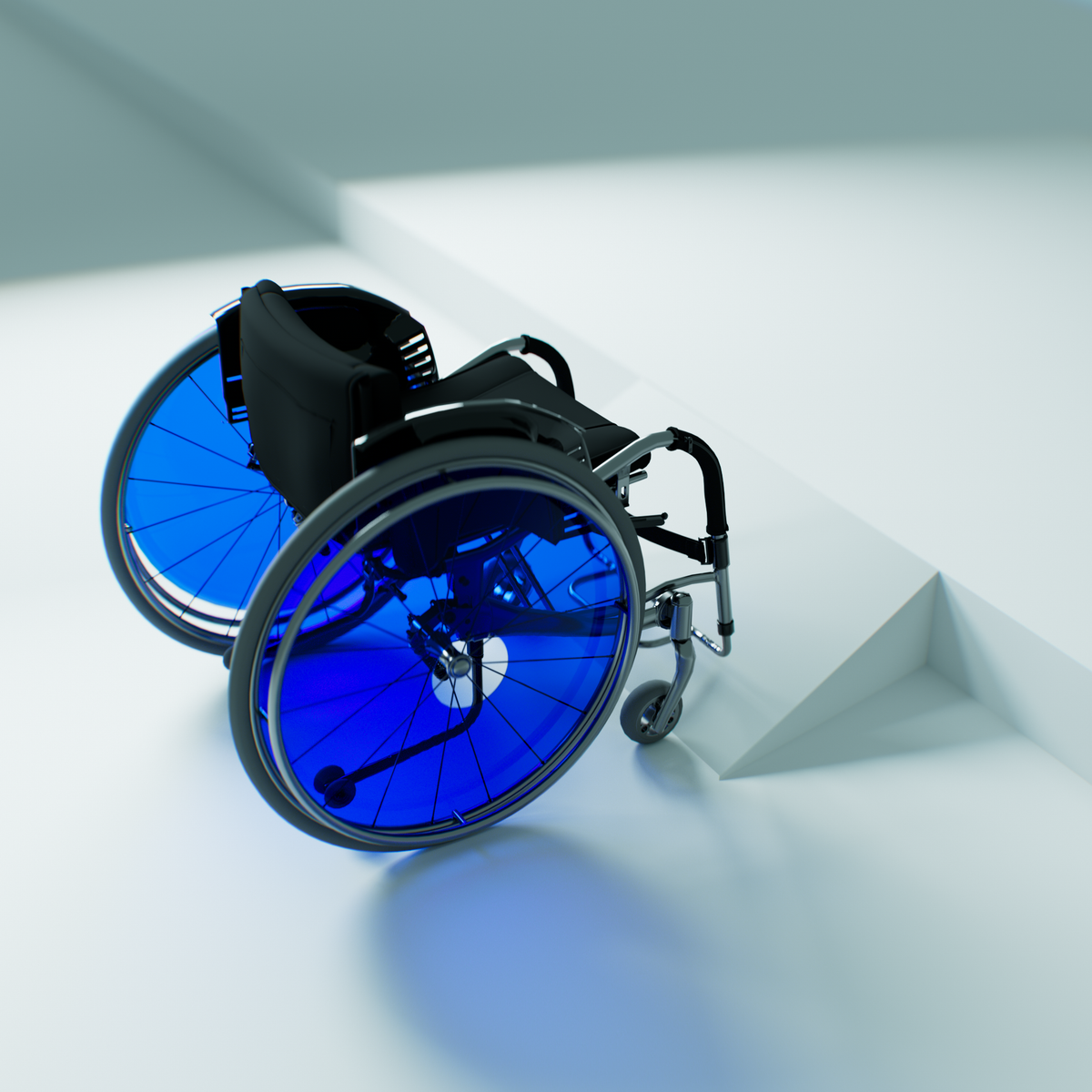 Blue spoke guards on a manual wheelchair positioned beside a white accessibility ramp.