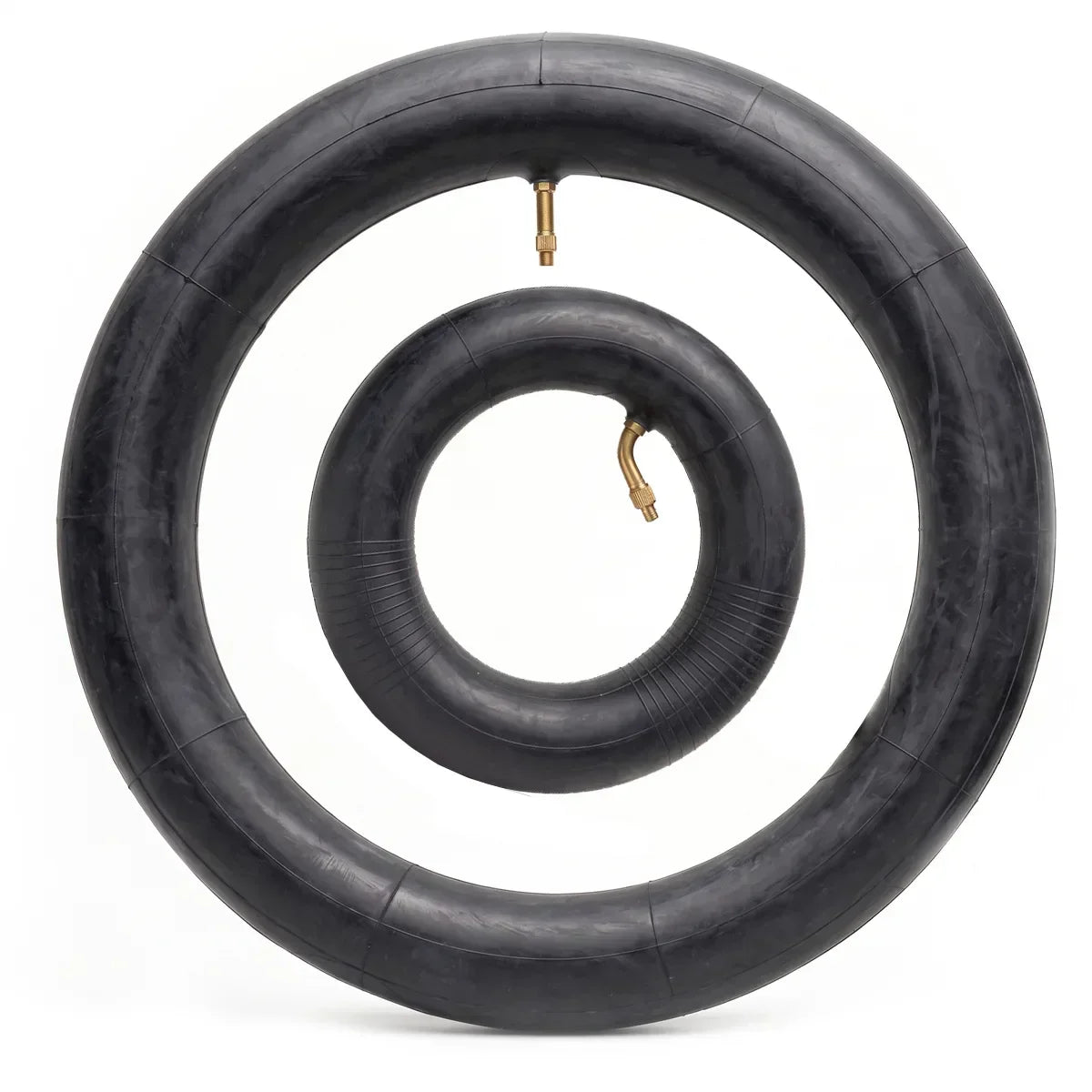 Two black rubber wheelchair inner tubes with metal valves on white background