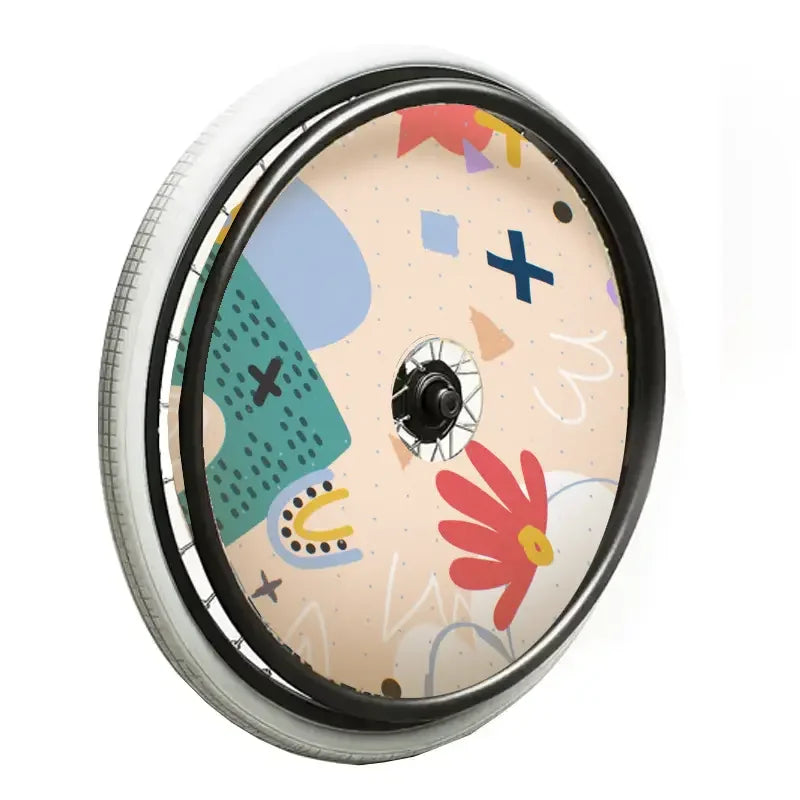 Kids wheelchair spoke guard with colorful abstract and floral design, orange vortex style