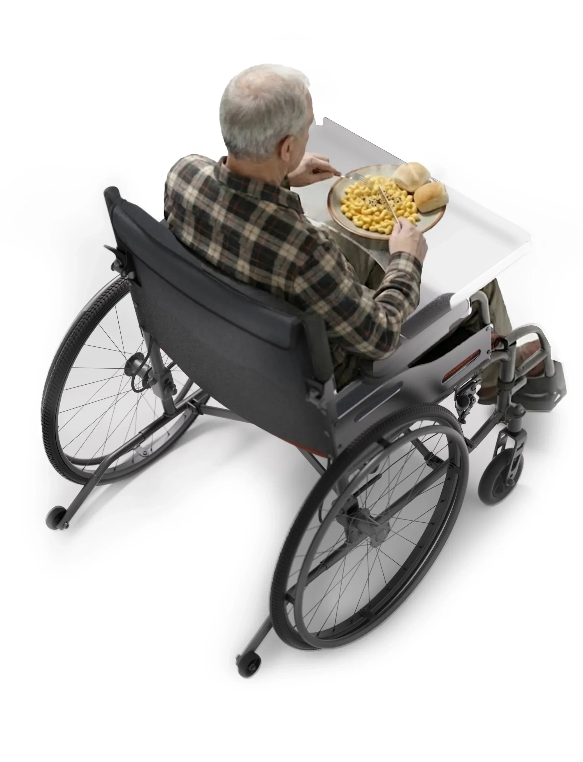 Wheelchair user eating on a tray with raised edges for spill protection
