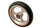 Durable wheelchair wheel with black tire and silver rim, ideal for mobility accessories and replacement parts.