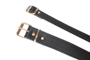 Black leather wheelchair safety straps with brass buckles for secure mobility support