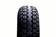 Durable wheelchair tire with deep tread pattern for enhanced grip and mobility