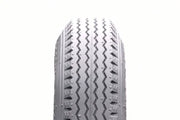 Durable wheelchair tire with zigzag tread pattern for smooth mobility and grip