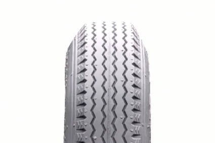 Durable wheelchair tire with zigzag tread pattern for smooth mobility and grip