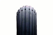 Black wheelchair tire with deep treads for durability and grip, ideal for mobility accessories