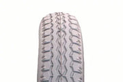 Durable wheelchair tire with deep tread pattern for enhanced grip and stability