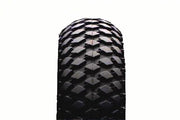 Heavy-duty wheelchair tire with rugged tread pattern for outdoor mobility and durability