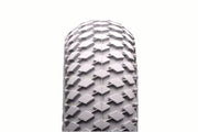 Durable wheelchair tire with rugged tread pattern for reliable mobility and traction
