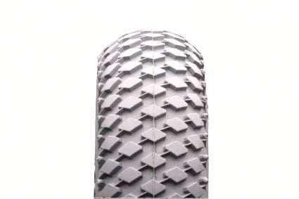 Durable wheelchair tire with rugged tread pattern for reliable mobility and traction
