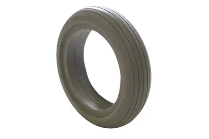 Durable wheelchair tire with tread pattern, designed for smooth mobility and everyday use.