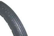 Durable wheelchair tire with deep tread pattern for reliable mobility and grip