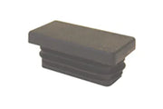 Black wheelchair armrest cap with textured top for grip and comfort
