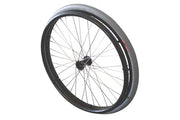 Black wheelchair wheel with silver spokes and durable tire, ideal for mobility and everyday use