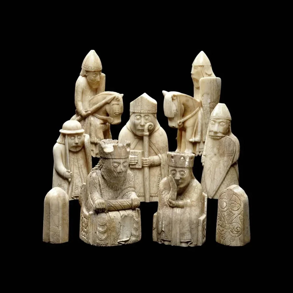 Historic ivory chess pieces with medieval figures against a black background