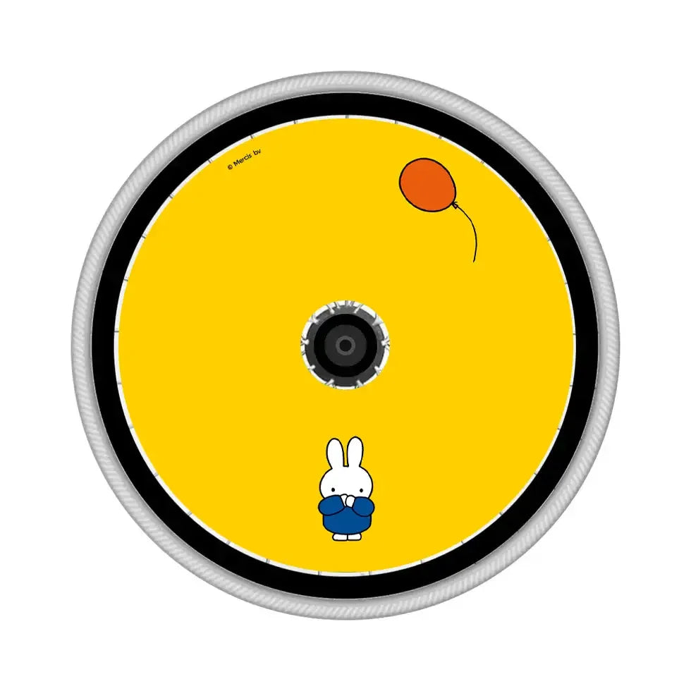 Yellow wheelchair spoke guard with cartoon rabbit and red balloon design