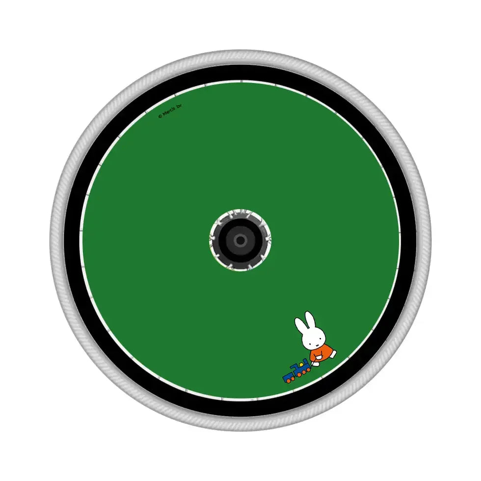 Green wheelchair spoke guard with cartoon bunny and toy train graphic