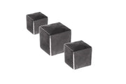 Three dark gray cubes arranged diagonally on white background