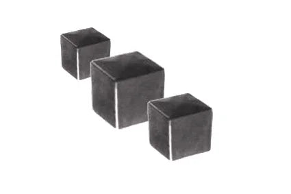 Three dark gray cubes arranged diagonally on white background