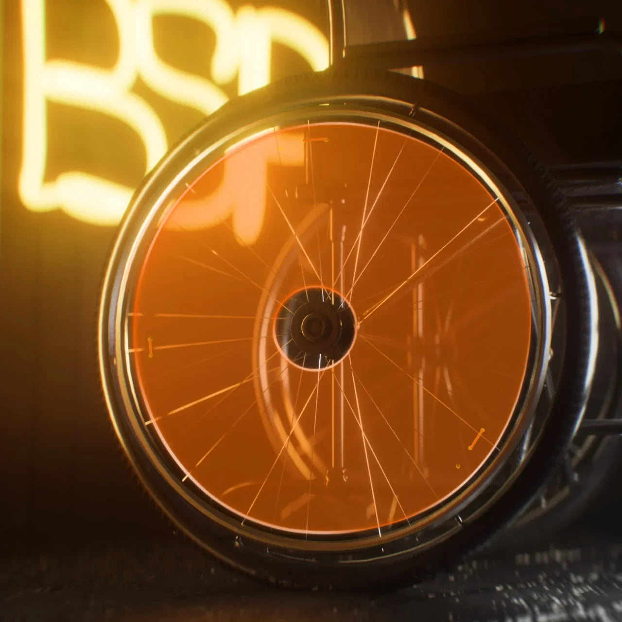 Wheelchair wheel with orange neon spoke protector in a dark indoor setting