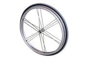 Silver wheelchair wheel with black tire and thin spokes, durable mobility accessory for everyday use