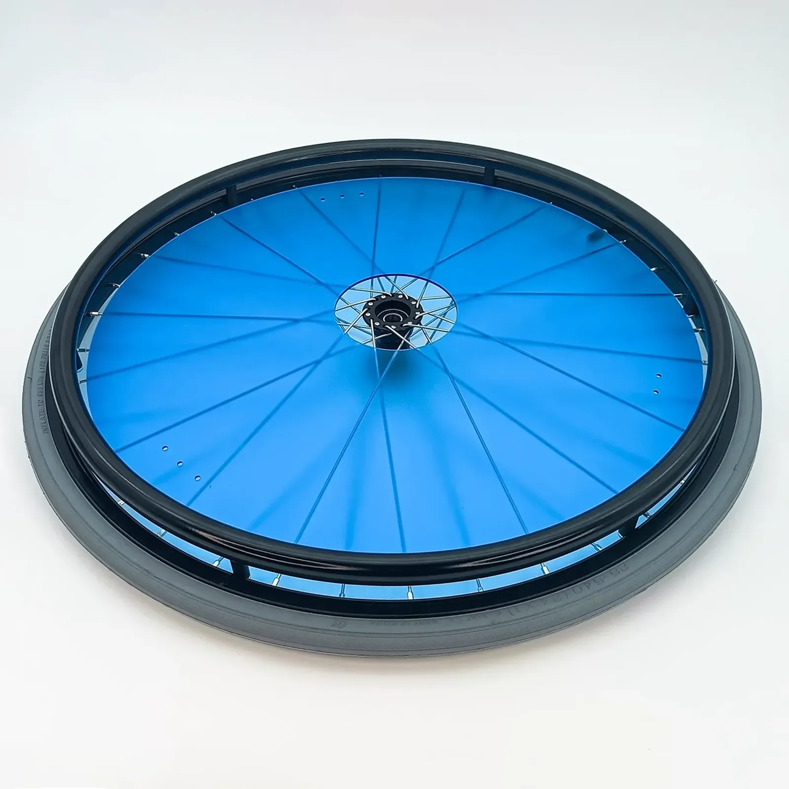 Blue wheelchair wheel with black rim and spokes, durable accessory for mobility devices