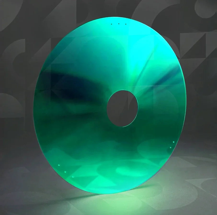 Green wheelchair spoke guard with central cutout on a neutral background