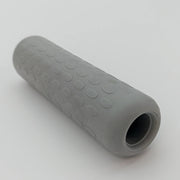 Gray textured wheelchair grip with non-slip dots for secure handling and comfort