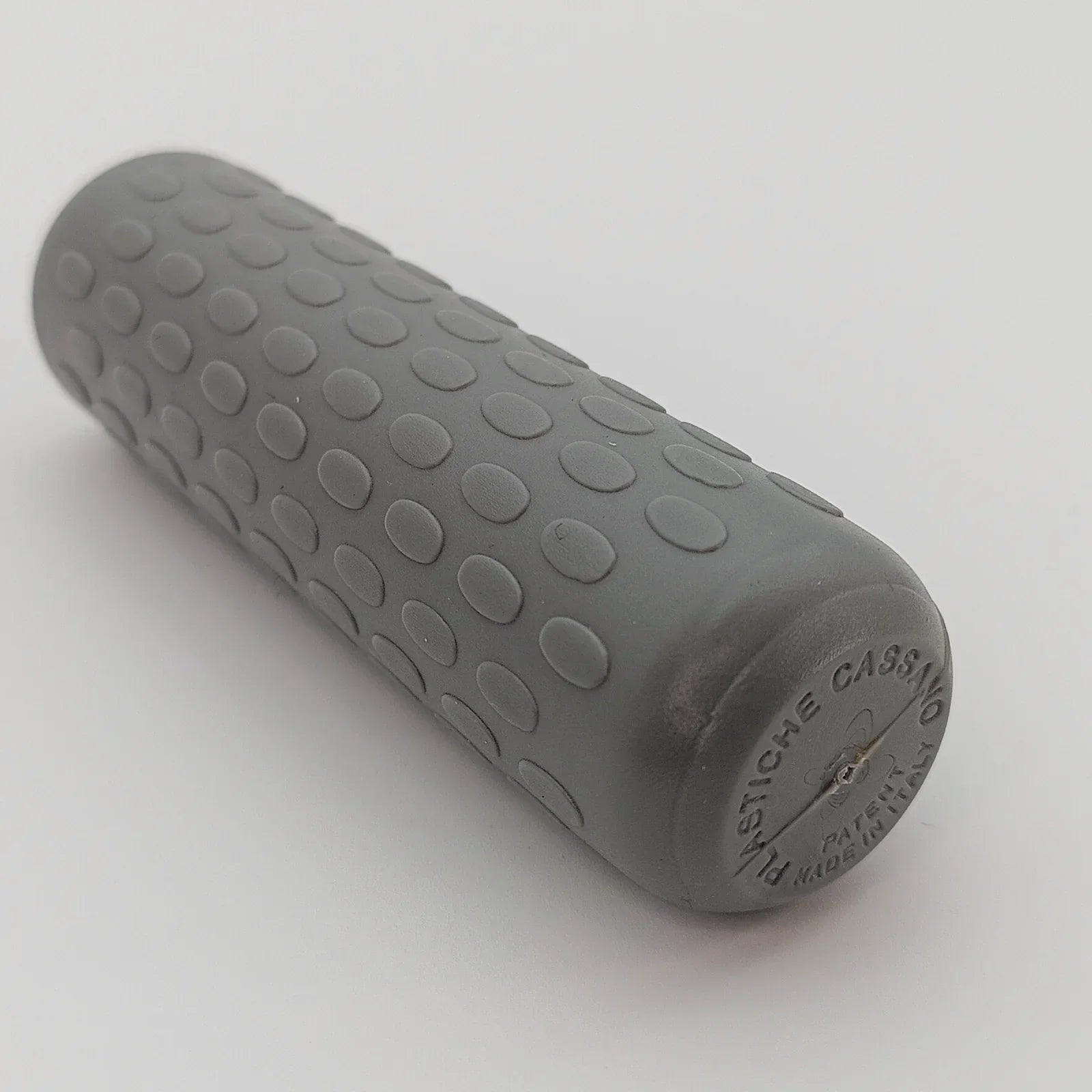 Gray textured wheelchair hand grip with ergonomic oval bumps, made in Italy for secure push rim control