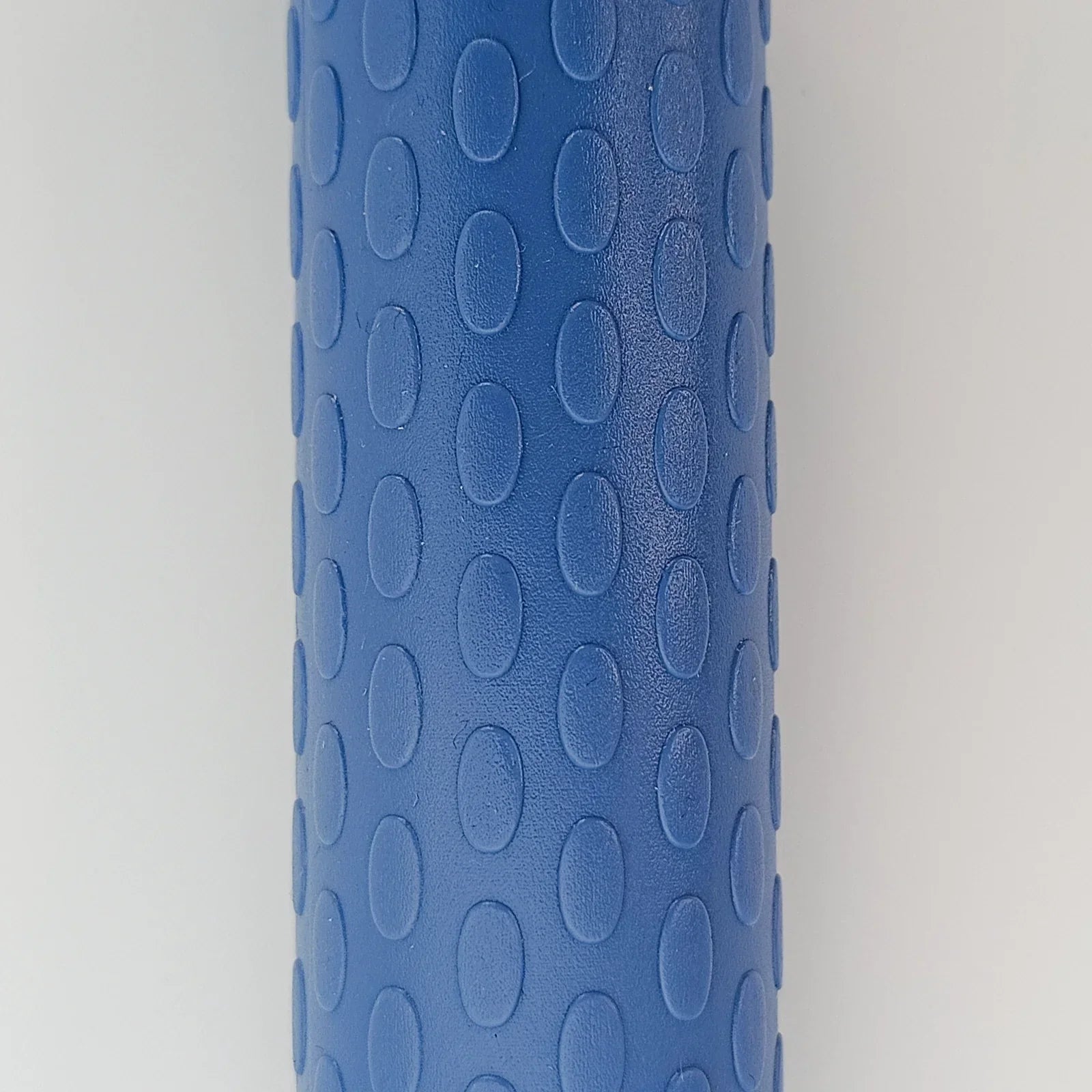 Blue textured wheelchair grip with oval patterns for secure handling