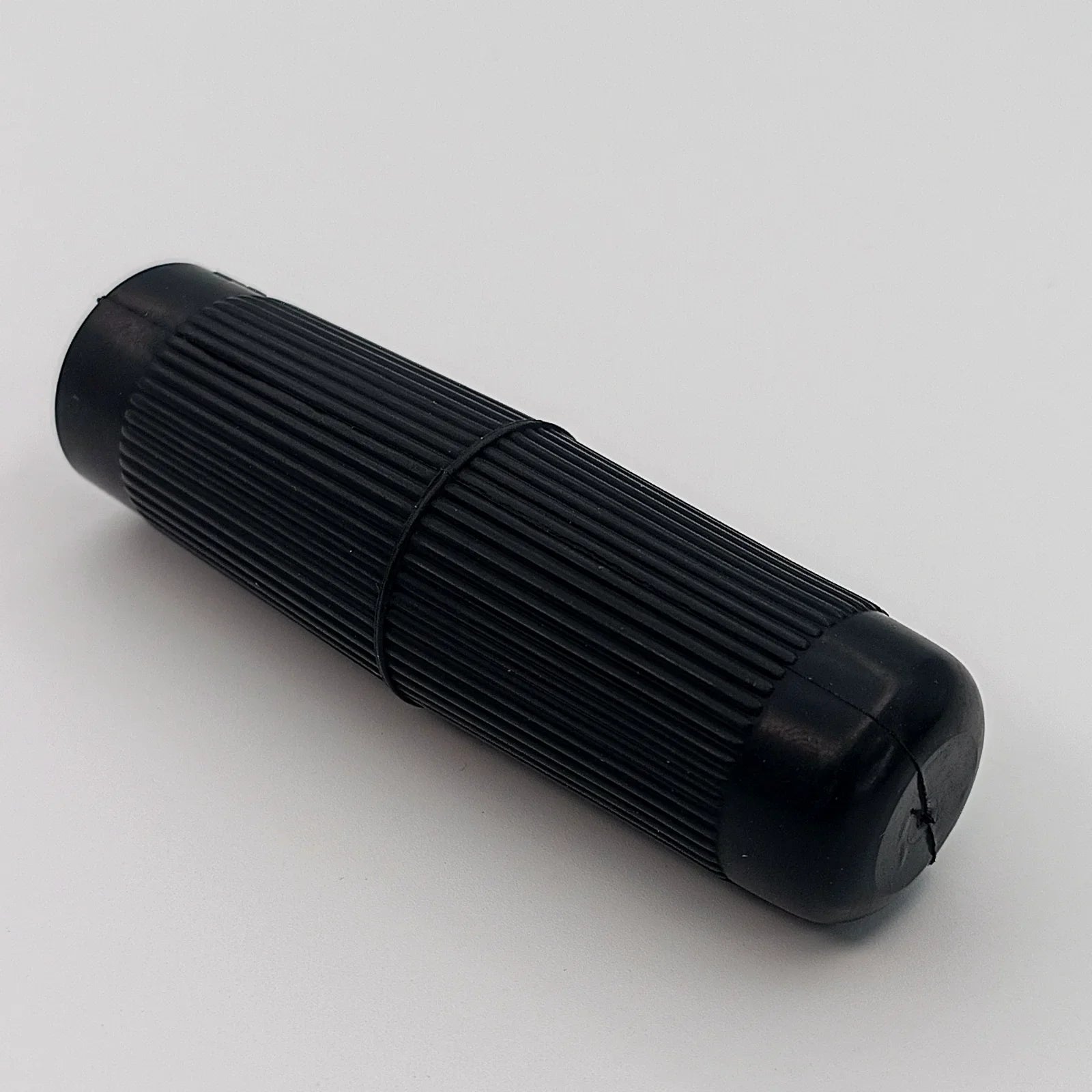 Black ribbed wheelchair hand grip for secure push rim control