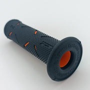 Black textured wheelchair grip with orange accents, durable ergonomic handle for mobility aids