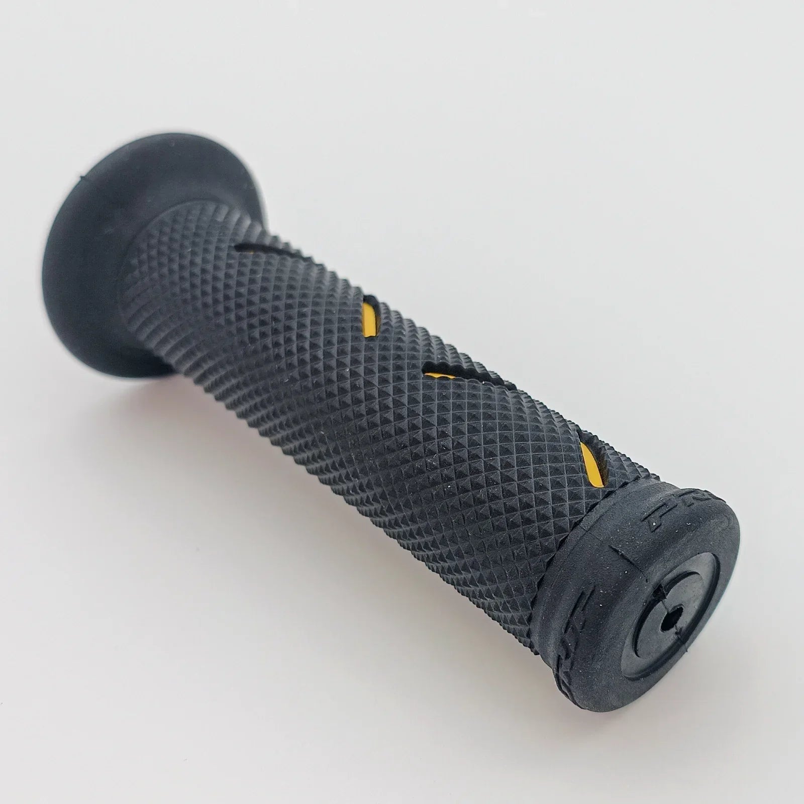 Black textured wheelchair hand grip with yellow accents for secure handling and comfort