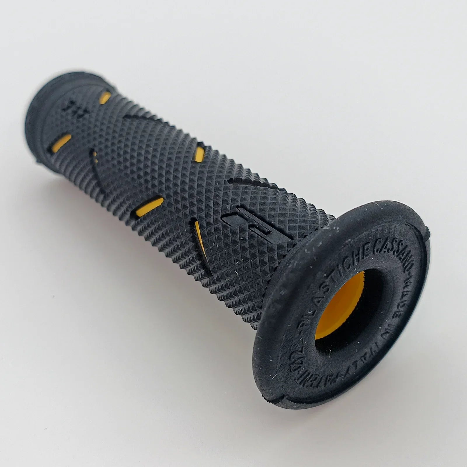 Black textured wheelchair handrim grip with yellow accents for secure push rim control