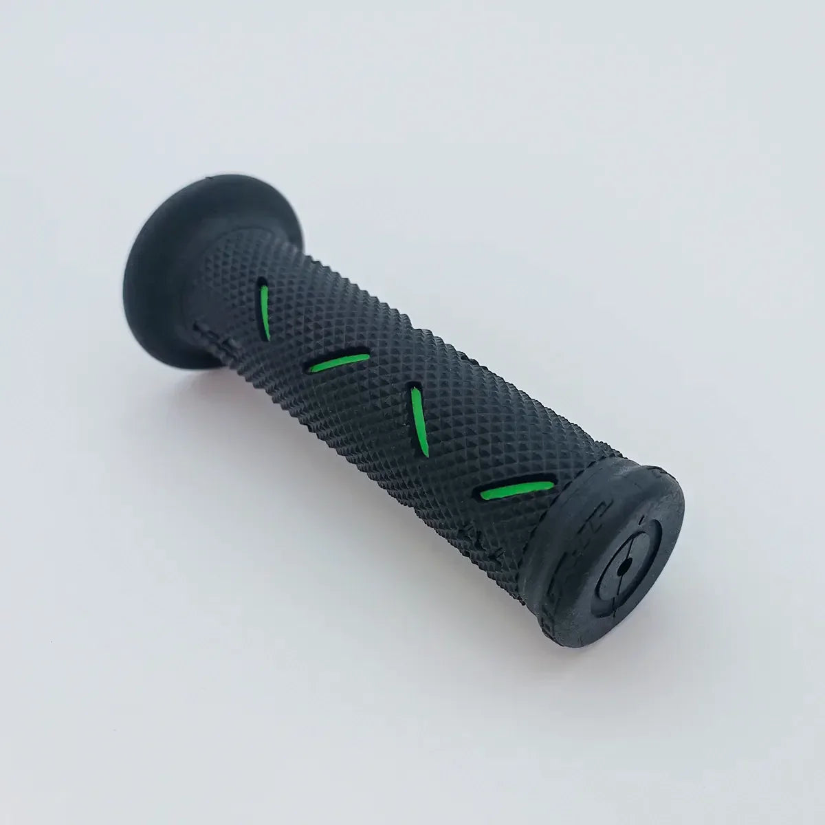 Black textured wheelchair grip with green accents for secure handling