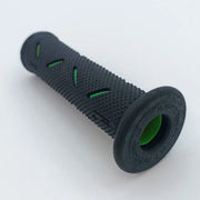 Black textured wheelchair grip with green accents, durable ergonomic handle for mobility aids