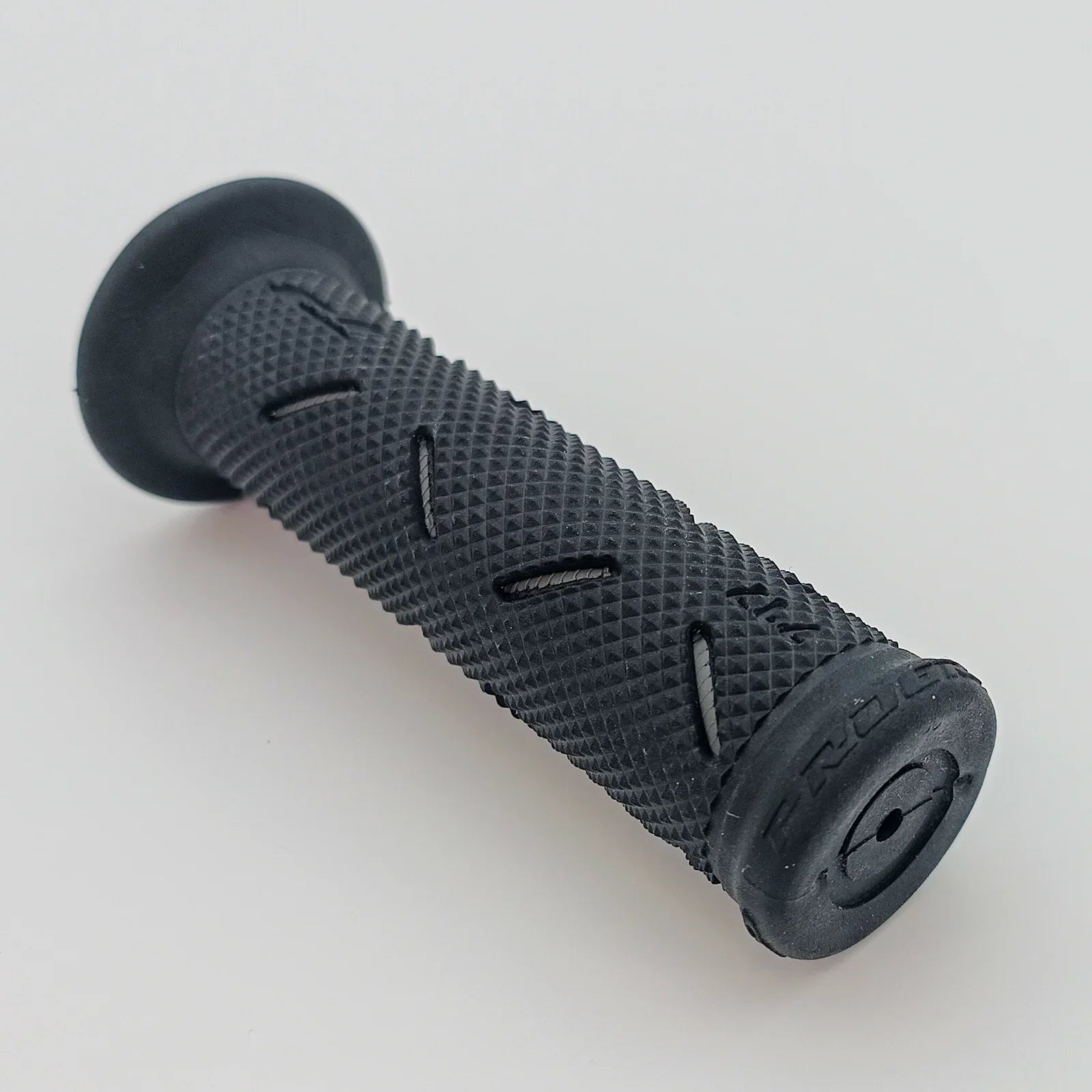 Black textured wheelchair hand grip with ergonomic design for secure hold and comfort