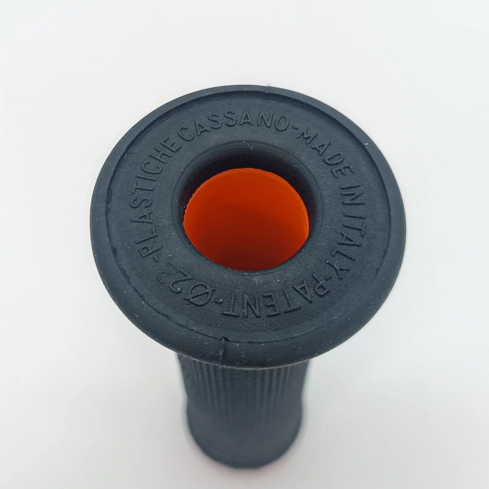 Black wheelchair grip with orange center, made in Italy, for durable mobility equipment