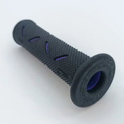 Black textured wheelchair grip with purple accents, durable ergonomic handle for mobility aids