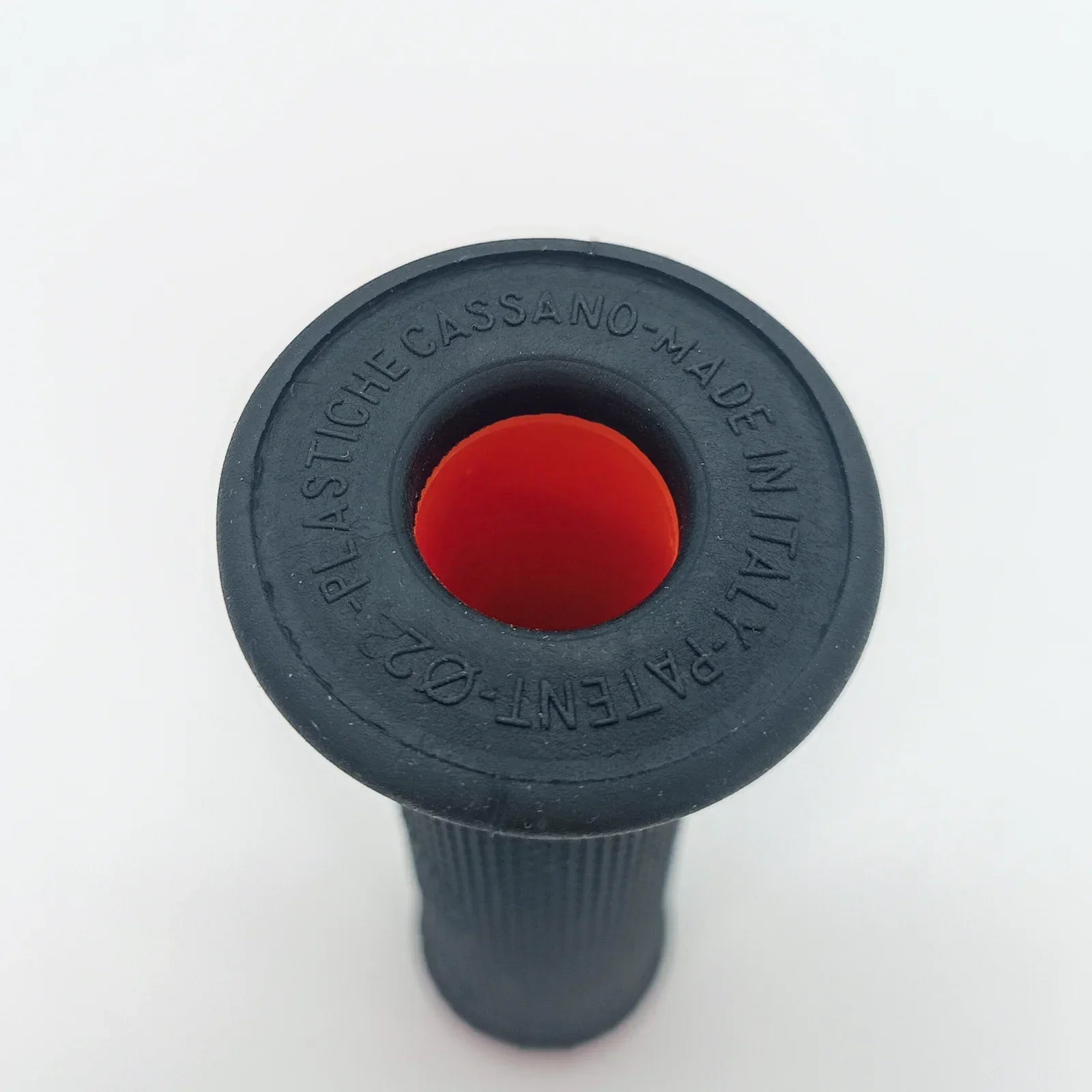 Black wheelchair grip with red center, made in Italy, for durable mobility equipment