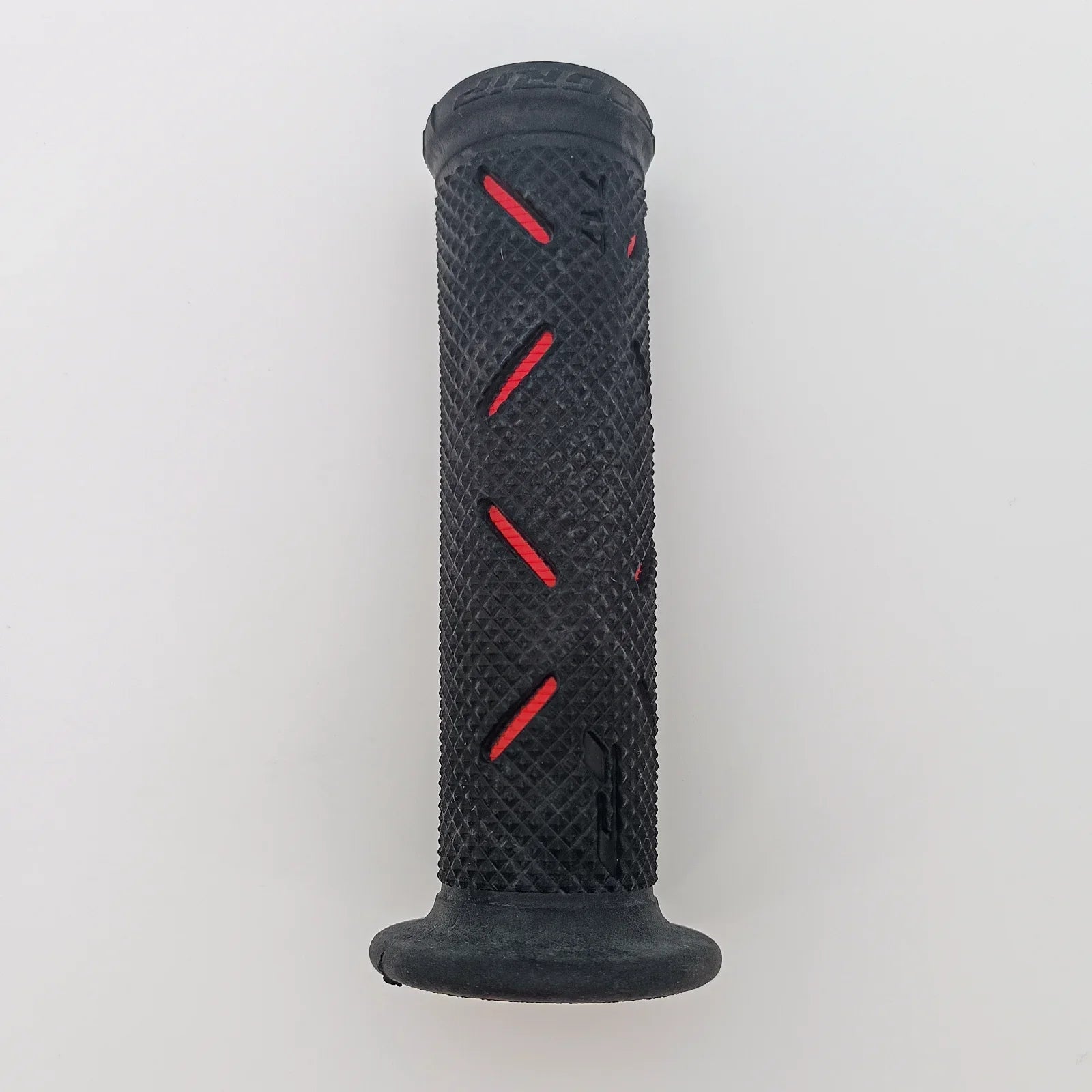 Black textured wheelchair grip with red accents for secure handling and comfort