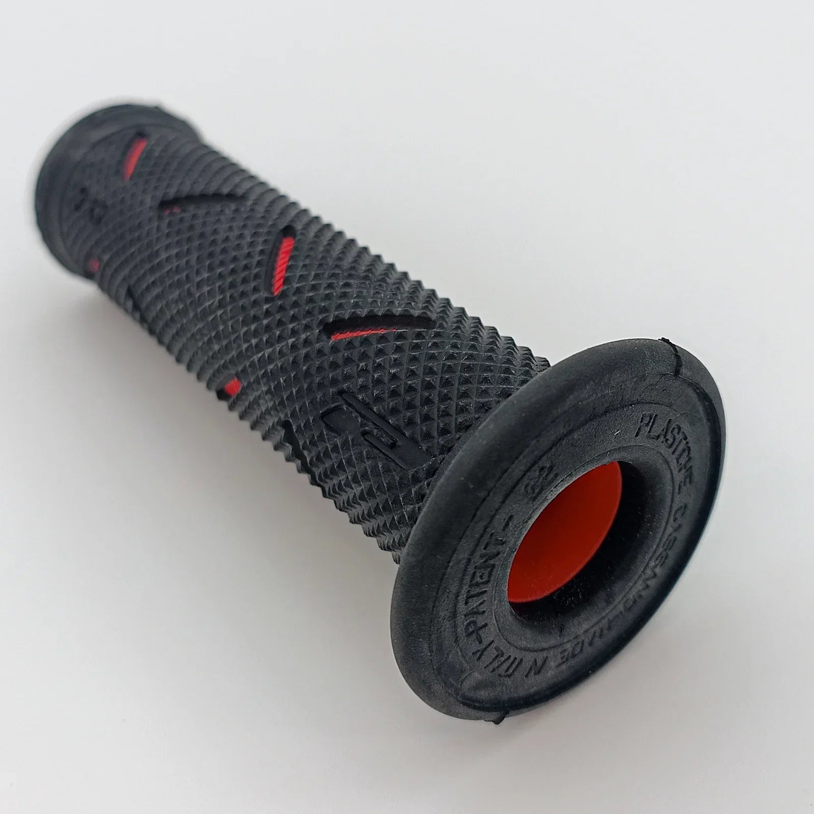 Black textured wheelchair grip with red accents, durable ergonomic handle for mobility aids