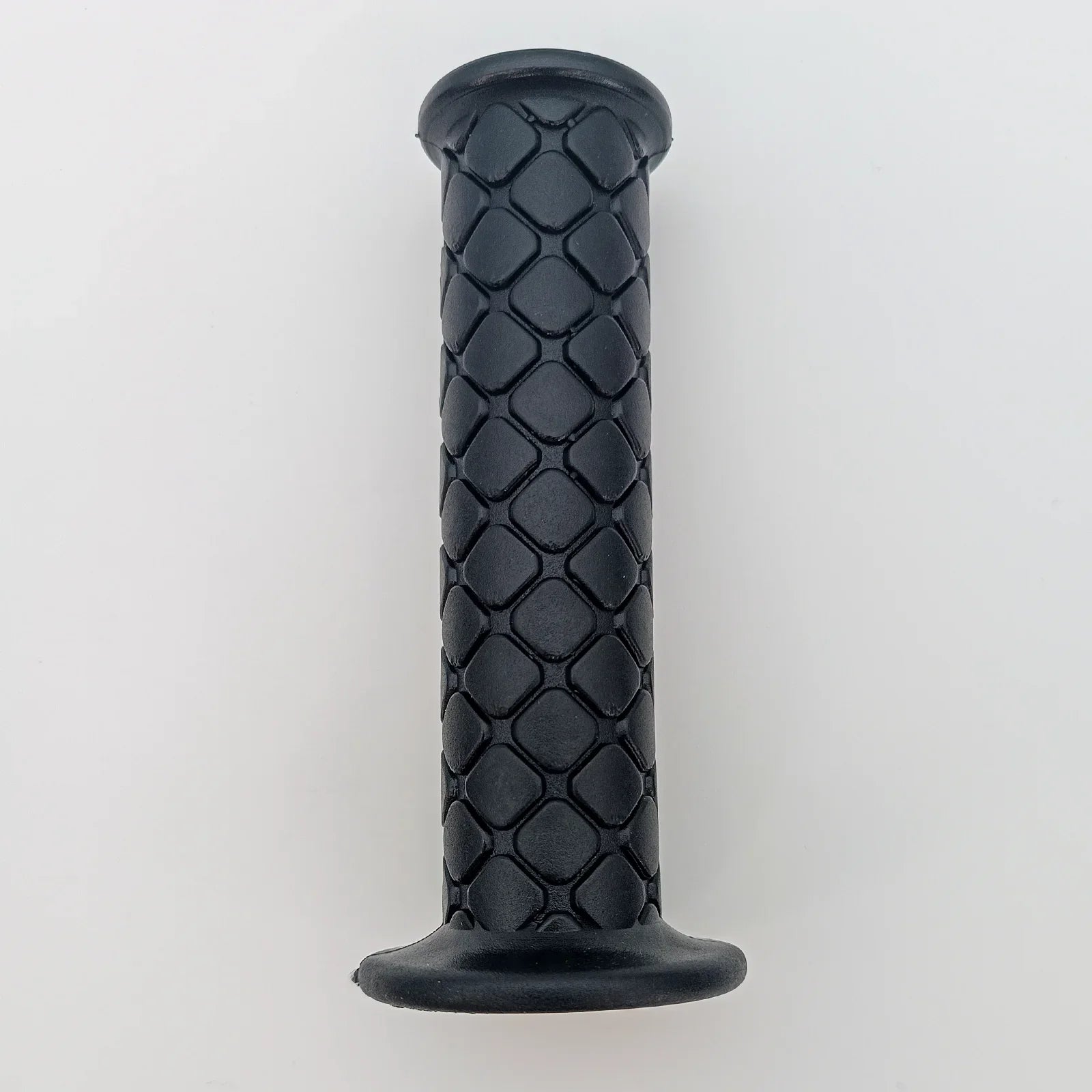Black textured wheelchair grip with diamond pattern for secure handling and comfort