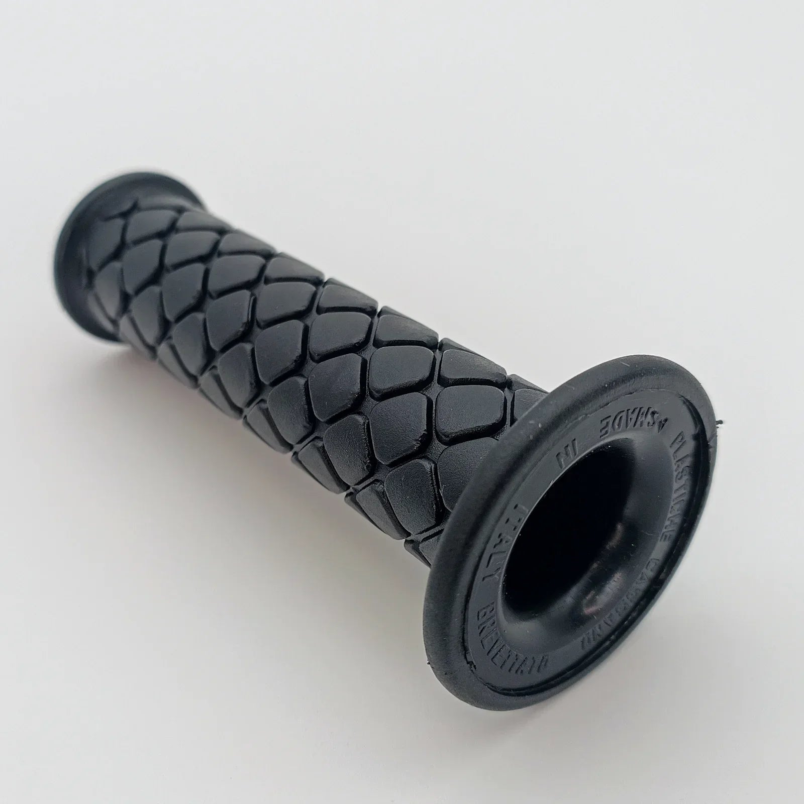 Black textured wheelchair grip with ergonomic design for secure handling and comfort