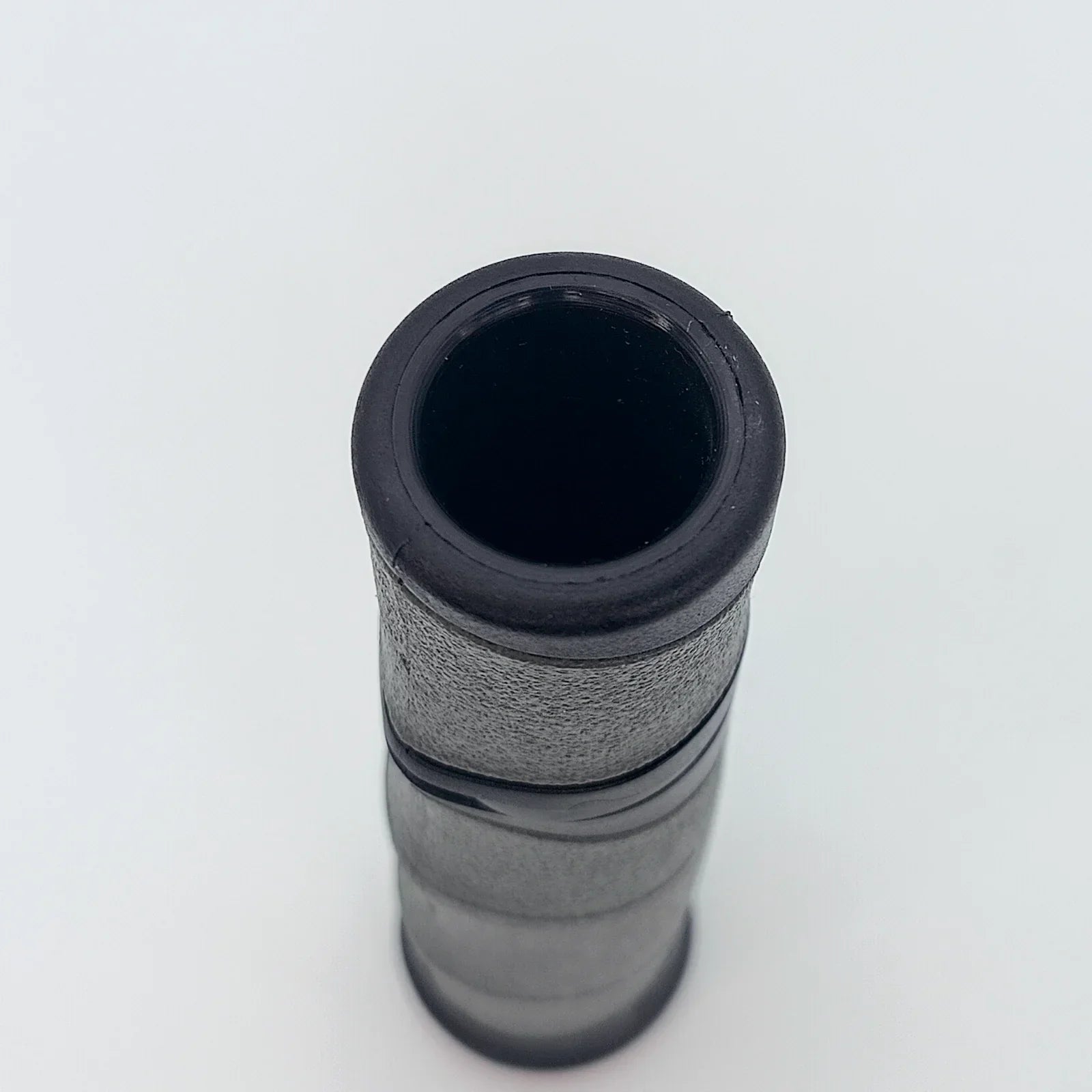 Black wheelchair grip with textured surface for secure handling, durable mobility accessory