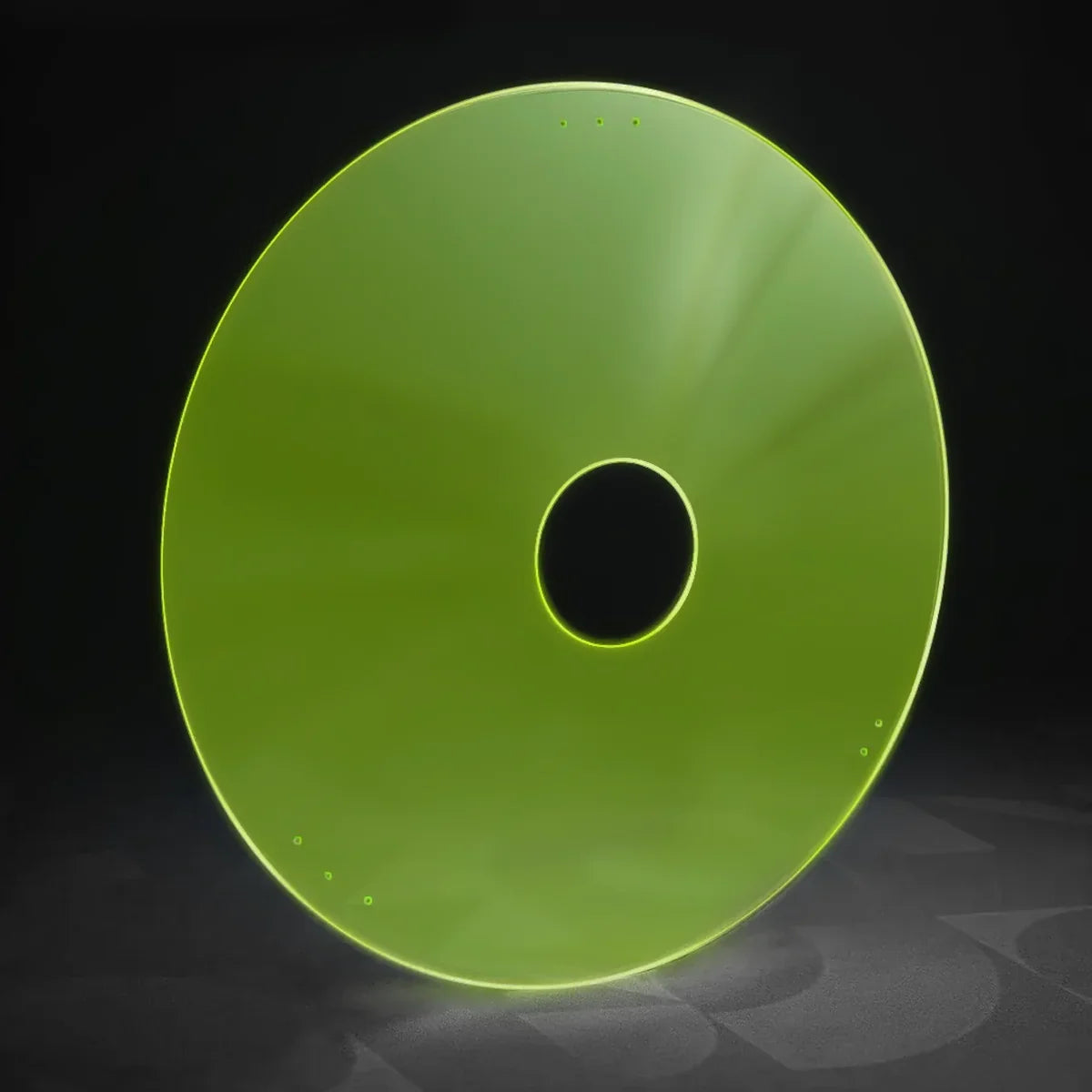Green wheelchair spoke guard with central hole and mounting holes, durable accessory for mobility devices
