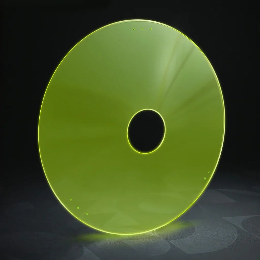 Neon green wheelchair spoke guard with round center hole on dark background