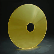 Golden wheelchair spoke guard with central hole and mounting dots, durable accessory for wheelchair wheels