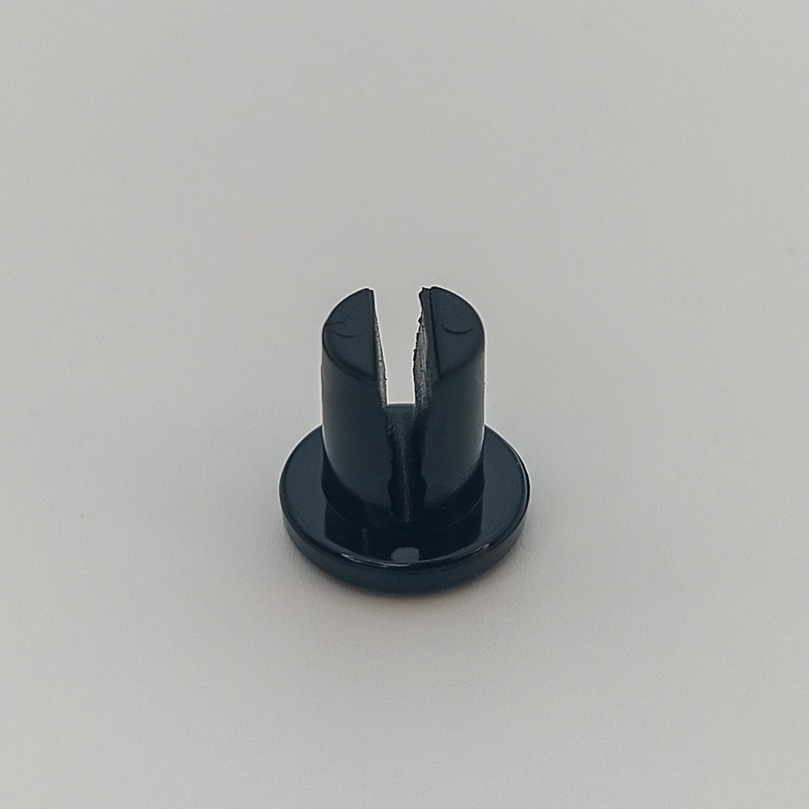 Black wheelchair spoke guard clip for secure wheel attachment