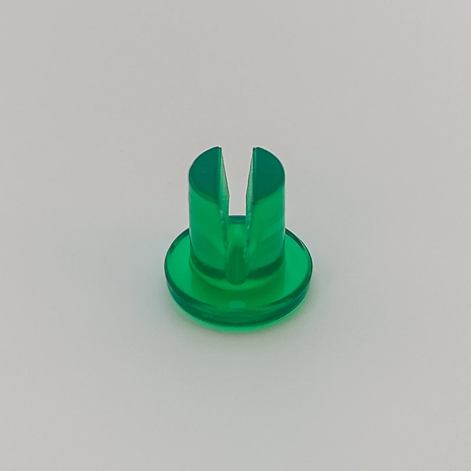 Green plastic wheelchair spoke guard accessory for wheelchair safety and protection